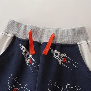 Boys navy joggers with cartoon rocket print and orange drawstring detail