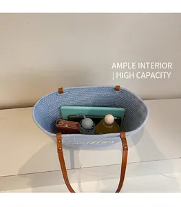 Top view of blue straw tote bag showing large capacity for tablet and daily items
