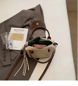 Interior view showing the capacity for smartphones and a wallet in the crossbody bag