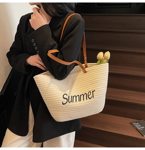Detail of Summer embroidery on cream woven tote bag with premium brown leather straps