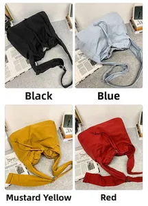 Sacs bandoulière à cordon en noir, bleu, jaune et rouge avec tissu texturé durable