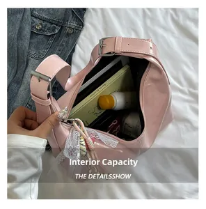 Macro view of pink hobo bag interior showing spacious capacity for daily essentials