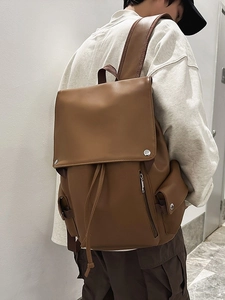 Vintage brown leather backpack with drawstring closure for daily commute and travel