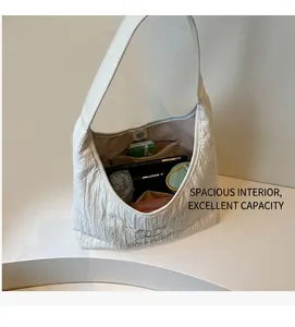 Interior view of large white canvas tote bag showing spacious storage for daily essentials