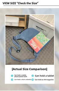 Size comparison of light blue denim half-moon bag showing capacity for A4 magazines