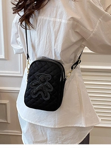 Black quilted crossbody mobile phone bag with sequined bear patch and gold zippers