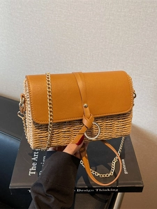 Fashionable straw woven flap crossbody bag with leather trim and gold ring detail
