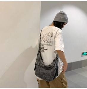 Charcoal grey large capacity crossbody bag with adjustable strap in washed denim