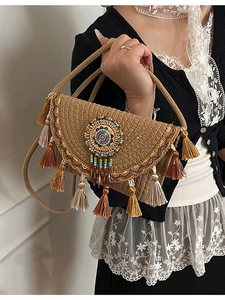 Bohemian woven shoulder bag with colorful fringe and beaded ethnic detail for women