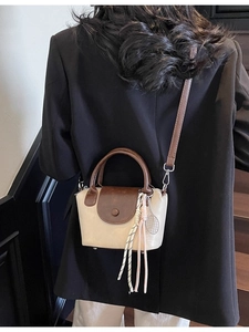 Chic beige and brown crossbody mini handbag with tennis racket charm accessory