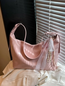 Pink PU leather crescent tote bag with lace bow decoration and adjustable shoulder strap