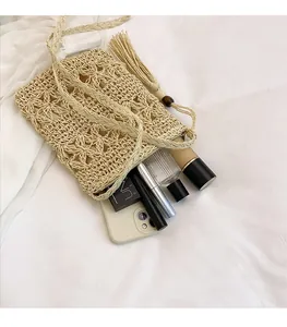 Top view of woven bucket bag showing interior space with phone and makeup items