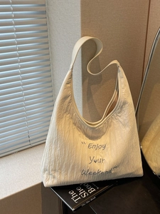 Large cream canvas tote bag with Enjoy Your Weekend embroidery for daily commuting