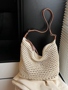 Bohemian hollow straw tote bag with brown leather straps and zip closure for women