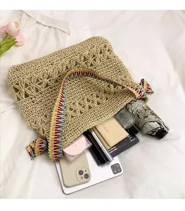 Flat lay of a woven straw tote bag showcasing large capacity for daily essentials