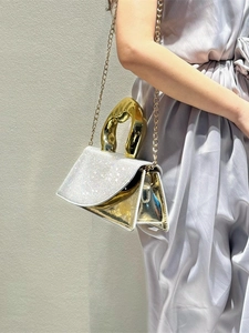 Silver glitter mini handbag with designer gold textured handle and metal chain strap