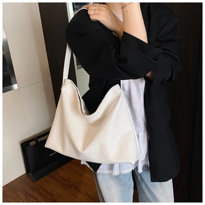 Detail showing the white woven texture and matte finish of this large hobo tote bag