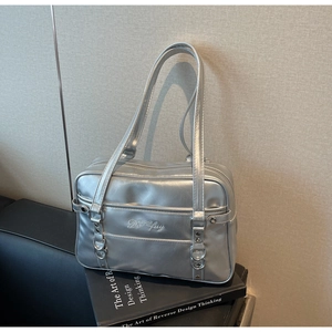 Detail showing the silver metallic glossy PU shoulder bag with Dofuy embroidery and metal rings