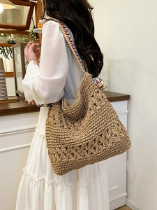 Large straw tote bag with colorful woven strap and hollow crochet pattern for summer