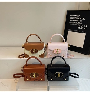 Detail of four retro mini crossbody bags in various colors with bear relief and gold locks