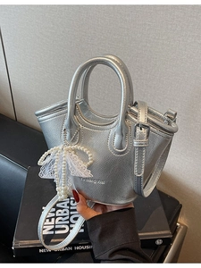 Silver metallic mini bucket bag with textured finish, pearl charm and crossbody strap