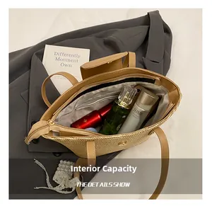 Spacious straw tote interior view with zipper pocket and brown leather trim detailing