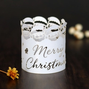 Detailed laser cut white pearl paper napkin ring with Santa Claus and Merry Christmas text