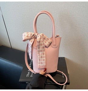 Pink lychee grain leather bucket bag with silk scarf detail and double handles