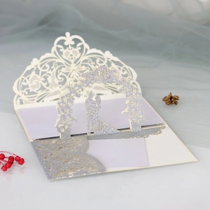 Detailed 3D laser-cut wedding card featuring a silver glitter bride and groom silhouette
