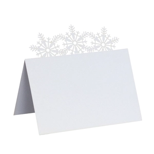 Detail of laser-cut snowflake place card made of premium white pearlescent paper