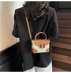 Model view of a vintage mini crossbody bag featuring a cute embossed bear and gold hardware