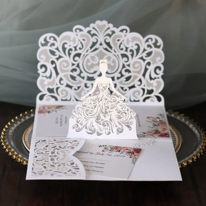 Elegant 3D laser-cut wedding invitation featuring a 3D bride silhouette and floral details