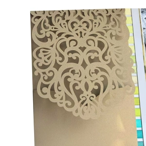 Elegant gold laser-cut wedding invitation with European scroll patterns on glitter paper