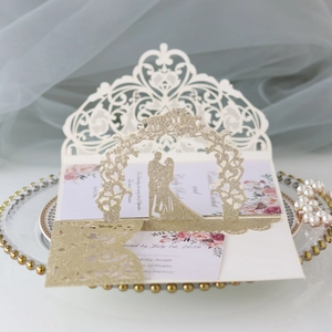 Elegant laser cut wedding invitation with gold glitter couple silhouette and roses