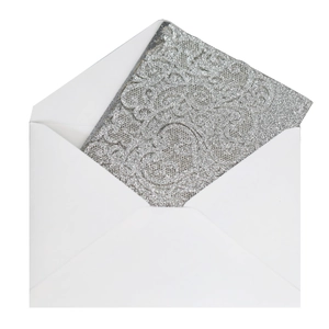 Detail of silver glitter wedding invitation card with floral relief and white envelope