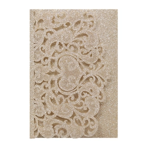 Detailed laser-cut champagne gold glitter paper with intricate floral pattern