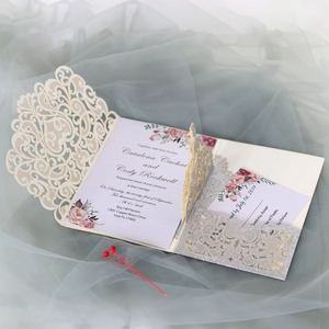 Detailed laser-cut wedding invitation set with elegant lace sleeve and glitter insert