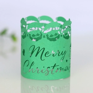 Detailed laser-cut green Christmas candle wrap featuring Santa Claus and Merry Christmas text