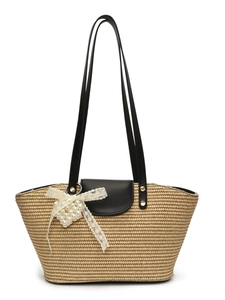 Handwoven straw tote bag with black faux leather straps and lace pearl bow decoration