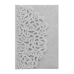 Detail of laser-cut rose hollow pattern on silver glitter wedding invitation card