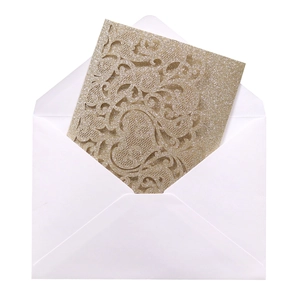 Champagne gold laser-cut floral invitation with glitter texture and white envelope