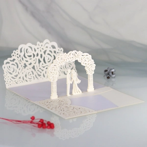 Laser cut 3D wedding invitation featuring a romantic rose arch and couple silhouette