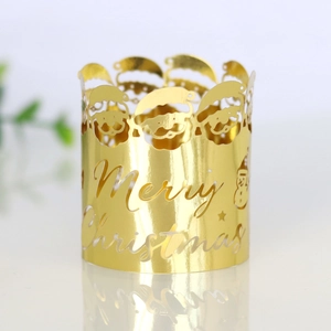 Gold laser-cut Christmas napkin ring with Merry Christmas text and Santa motif