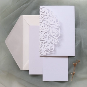 Laser-cut lavender wedding invitation set with rose design, inner cards, and envelope