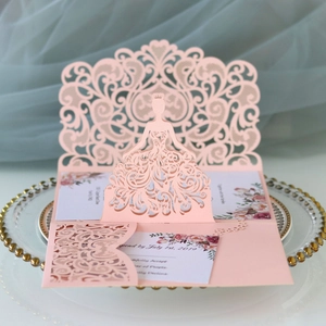 Elegant laser-cut wedding invitation set in pink with lace-style floral bride silhouette