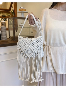 Handmade white macrame crossbody bag with bohemian fringes and geometric patterns