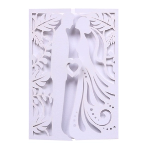 Detailed laser-cut wedding invitation cover with elegant bride and groom silhouette design