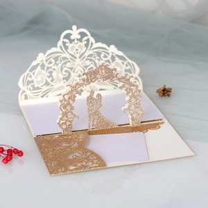 Detail of 3D pop-up wedding invitation featuring laser-cut gold glitter floral arch