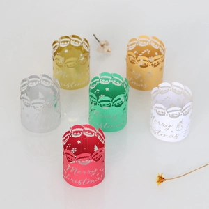 Close-up of laser-cut Christmas paper rings with Santa and snowflake festive patterns