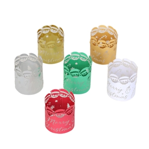 Laser-cut Christmas paper candle covers in six colors featuring Santa and snowflakes
